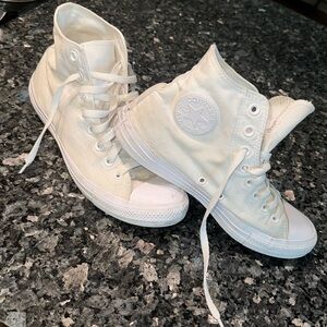 All white High Top Converse shoes